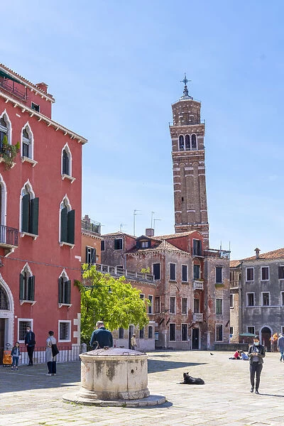 Venice, Veneto, Italy. The leaning bell tower of Santo Stefano and city square