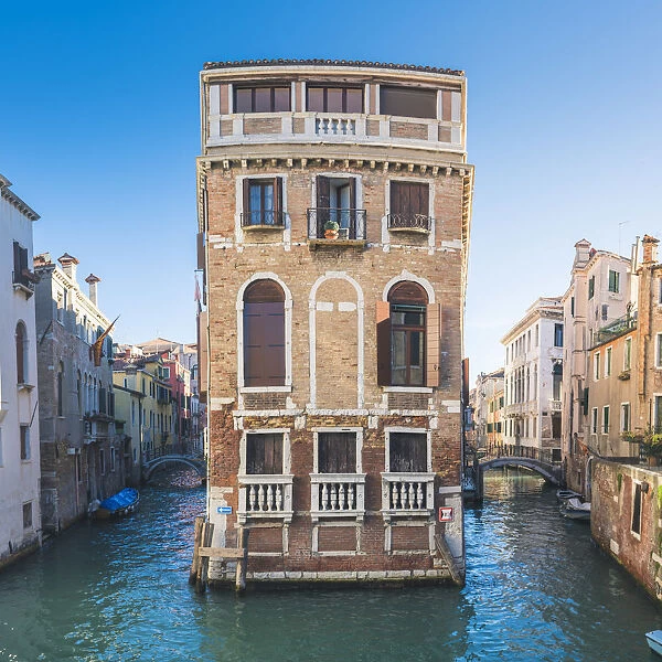Venice, Veneto, Italy. Palace on a narrow canal