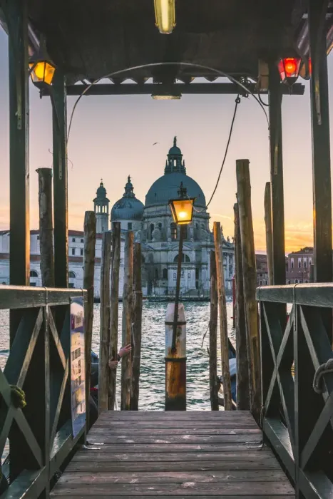 Framed Print : Venice, Veneto, Italy. Salute (St Mary of Health) Basilica and wooder pier at dusk