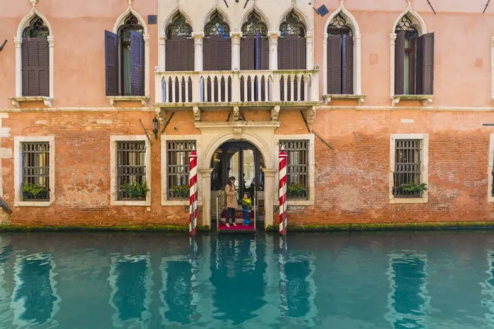 Framed Print : Venice, Veneto, Italy. Tourists on the pier of a Waterfront palace hotel
