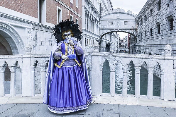 Venice, Veneto, Italy. Traditional costume for the historical Carnival and Bridge
