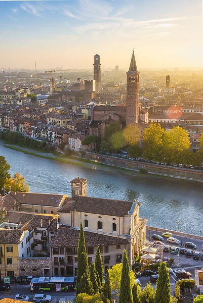 Verona, Veneto, Italy. High angle view of the old town and the Adige river at sunset