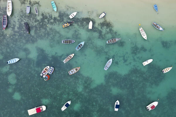 a vertical shot of a boats on the crystalline sea, Black River, Mauritius