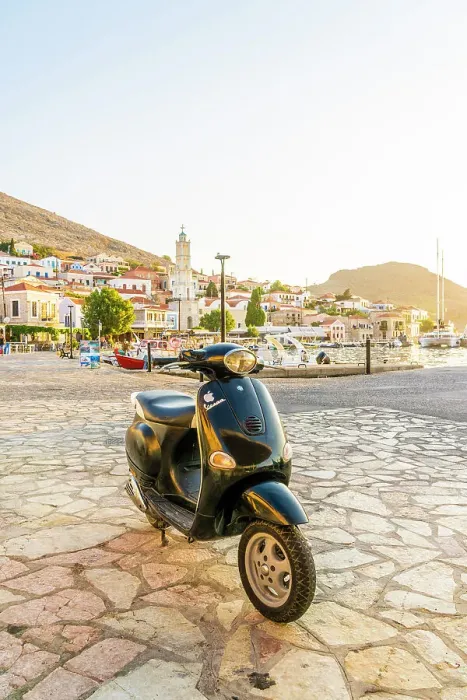 Framed Print : A Vespa motor cycle by the Harbour in Halki, Dodecanese Islands, Greece Framed Print : A Vespa motor cycle by the Harbour in Halki, Dodecanese Islands, Greece