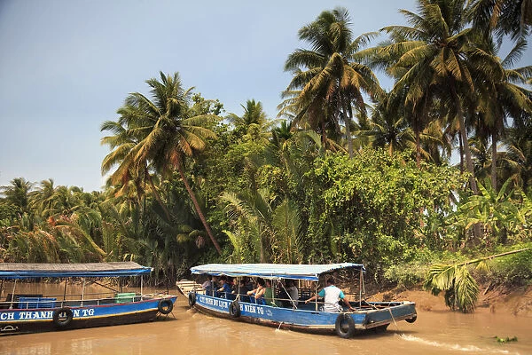 Vietnam, Mekong Delta, My Tho, Tourist boats on the delta canals