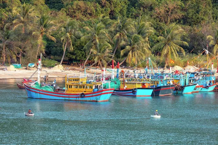 Framed Print : Vietnam, Phu Yen, traditional fishing boats a moored up on a tropical beach