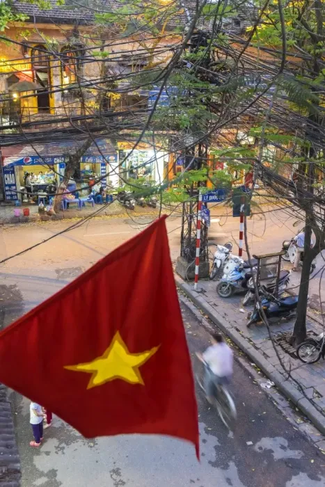 Framed Print : Vietnamese flag & street scene, Hanoi, Vietnam
