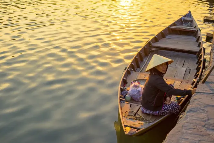 Framed Print : Vietnamese woman in a boat on the Thu Bon River at sunset, Hoi An, Quang Nam Province Framed Print : Vietnamese woman in a boat on the Thu Bon River at sunset, Hoi An, Quang Nam Province