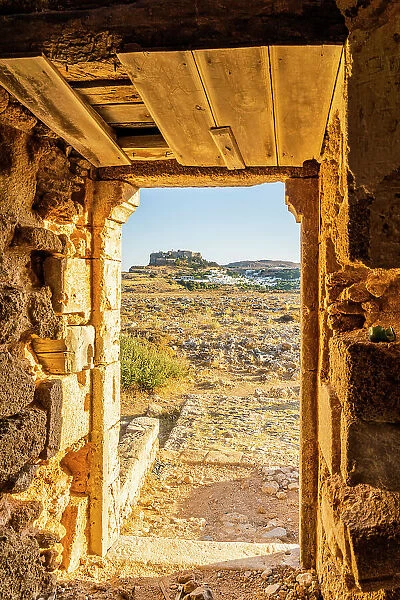 A view of the Acropolis of Lindos through an old windmill, Lindos, Rhodes, Dodecanese Islands, Greece