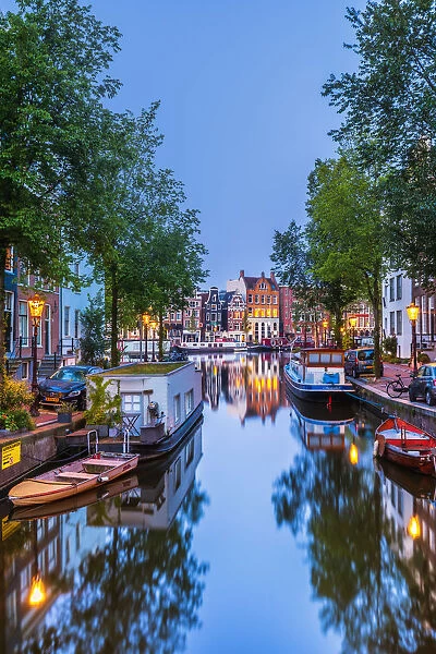 View of the Amsterdam water canal and the typical houses at dusk, Holland  /  Netherlands