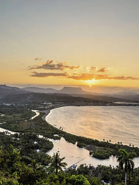 View over Bahia de Miel towards city and El Yunque Mountain at sunset, Baracoa