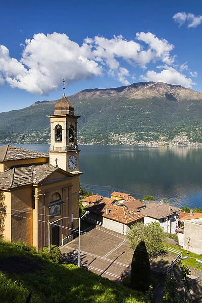 View of the bell tower and village of Dorio surrounded by Lake Como Province of Lecco