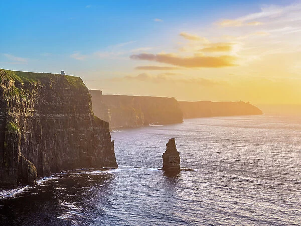 View towards the Branaunmore Sea Stack and O'Brien's Tower at sunset, Cliffs of Moher, County Clare, Ireland
