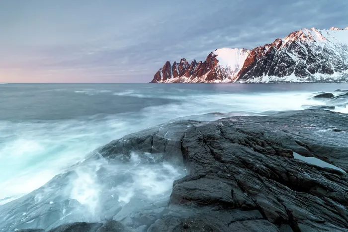 Framed Print : View along the coastline at sunset towrds the Devil's Teeth (Okshornan Peaks) in winter, Tungeneset, Senja Island, Norway Framed Print : View along the coastline at sunset towrds the Devil's Teeth (Okshornan Peaks) in winter, Tungeneset, Senja Island, Norway