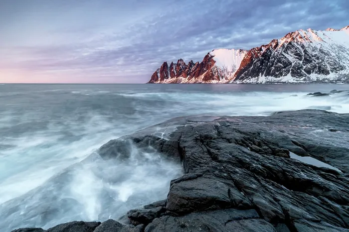 Framed Print : View along the coastline at sunset towrds the Devil's Teeth (Okshornan Peaks) in winter, Tungeneset, Senja Island, Norway Framed Print : View along the coastline at sunset towrds the Devil's Teeth (Okshornan Peaks) in winter, Tungeneset, Senja Island, Norway