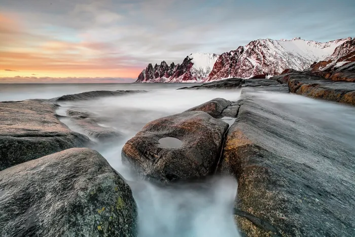 Framed Print : View along the coastline at sunset towrds the Devil's Teeth (Okshornan Peaks) in winter, Tungeneset, Senja Island, Norway Framed Print : View along the coastline at sunset towrds the Devil's Teeth (Okshornan Peaks) in winter, Tungeneset, Senja Island, Norway
