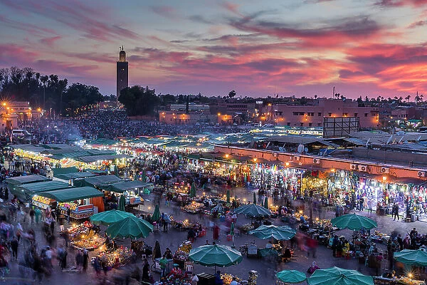 View over Djemaa el-Fna square and market place at dusk, Marrakesh, Morocco