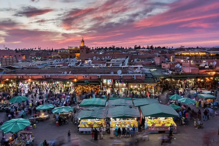 Framed Print : View over Djemaa el-Fna square and market place toward Koutoubia Mosque at dusk, Marrakesh, Morocco Framed Print : View over Djemaa el-Fna square and market place toward Koutoubia Mosque at dusk, Marrakesh, Morocco