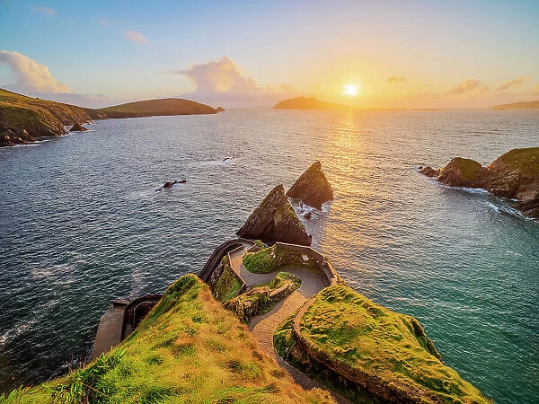 View over Dunquin Pier towards Dunmore Head and Blasket Islands at sunset, Dingle Peninsula, County Kerry, Ireland