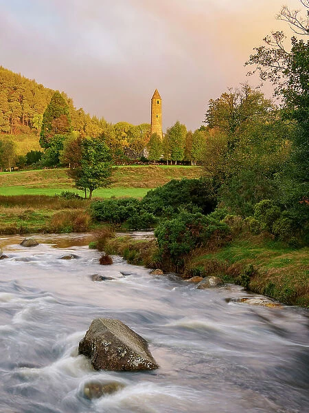 View over Glendasan River towards The Round Tower at sunrise, Early Medieval Monastic Settlement, Glendalough, County Wicklow, Ireland