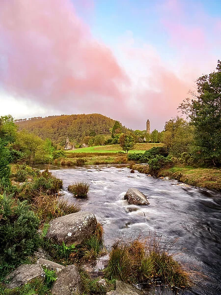View over Glendasan River towards St. Kevin's Church and The Round Tower at sunrise, Early Medieval Monastic Settlement, Glendalough, County Wicklow, Ireland