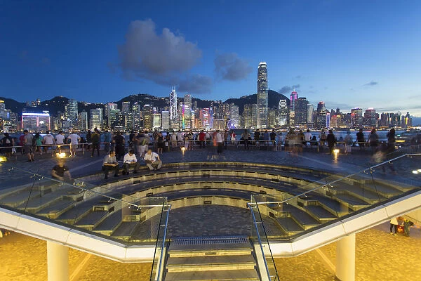 View of Hong Kong Island skyline from Tsim Sha Tsui promenade at dusk, Hong Kong, China