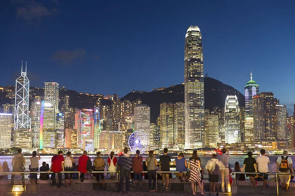 View of Hong Kong Island skyline from Tsim Sha Tsui promenade at dusk, Hong Kong, China