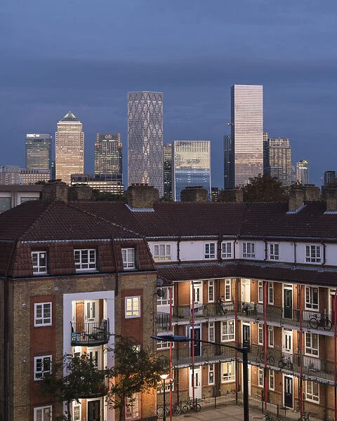 View of Housing Estate in Rotherhithe with Canary Wharf in background, London, England