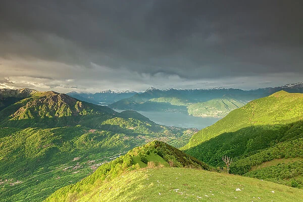 view of lake Como and mount Grona over the top of mount Calbiga during a sunset in spring, Lombardy, Italy Europe