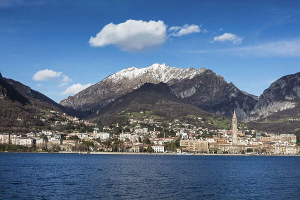 View of Lake Como surrounding the city of Lecco framed by snowy peaks Lombardy Italy