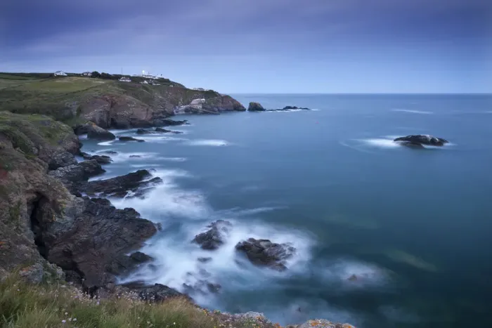 Framed Print : View from Lizard Point over rocky Polpeor Cove and onto the Lizard Lighthouse