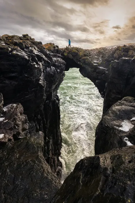 Framed Print : View of a man standing on the Stone Bridge. Arnarstapi, Snaefellsnes peninsula, Iceland (MR) Framed Print : View of a man standing on the Stone Bridge. Arnarstapi, Snaefellsnes peninsula, Iceland (MR)