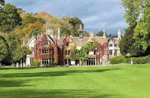 View towards The Manor House, 14th century building set in 365 acres of secluded parkland in the Cotswold village Castle Combe, Wiltshire, Cotswolds, England