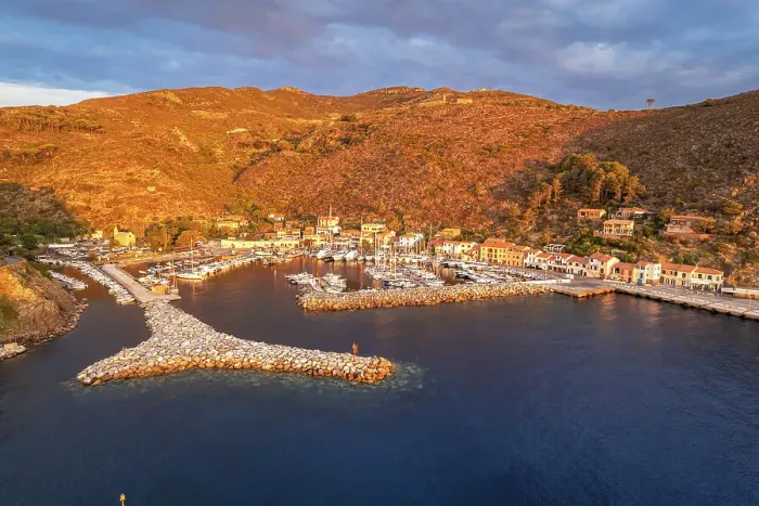 Framed Print : View of the marina of Capraia island at sunrise, aerial view, Tuscan Archipelago National Park, Livorno province, Tuscany, Italy Framed Print : View of the marina of Capraia island at sunrise, aerial view, Tuscan Archipelago National Park, Livorno province, Tuscany, Italy