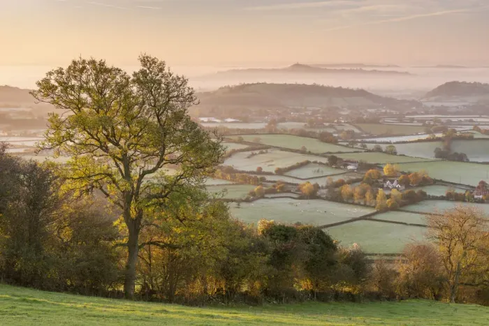 Framed Print : View from the Mendips over frost covered Somerset Levels towards Glastonbury Tor Framed Print : View from the Mendips over frost covered Somerset Levels towards Glastonbury Tor