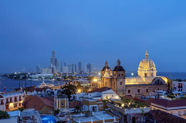 View over Old Town towards San Pedro Claver Church and Bocagrande at dusk, Cartagena