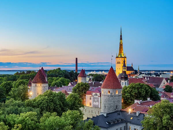 View over the Old Town towards St Olafs Church at dusk, Tallinn, Estonia