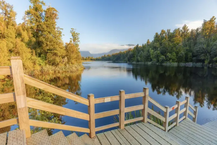 Framed Print : View of the peaceful Lake Matheson with the Fox glacier