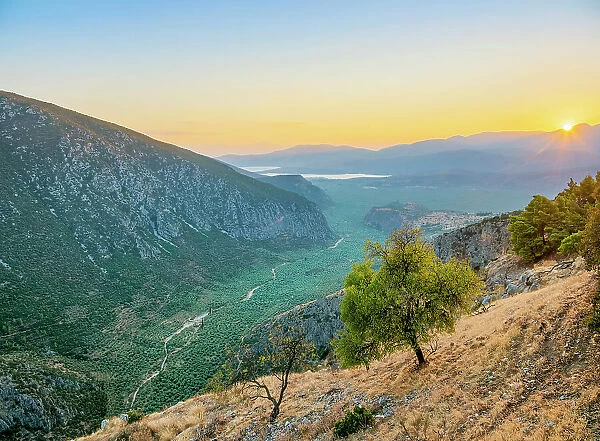 View over the Pleistos River Valley towards the Gulf of Corinth at sunset, Delphi, Phocis, Greece