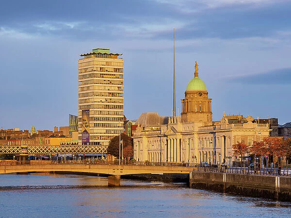 View over River Liffey towards The Custom House and The Spire at sunrise, Dublin, Ireland
