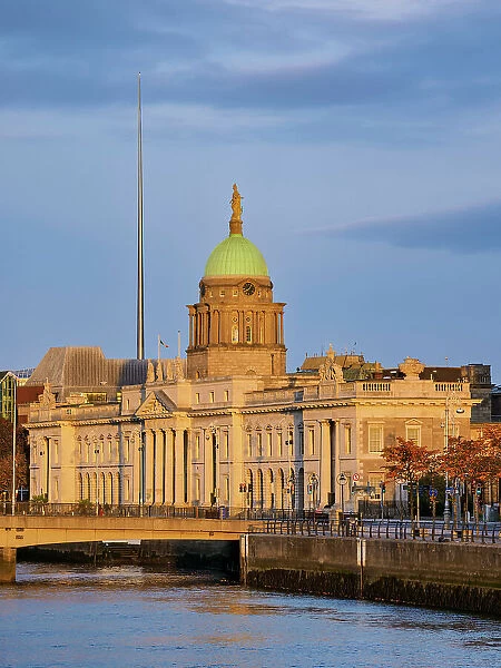 View over River Liffey towards The Custom House and The Spire at sunrise, Dublin, Ireland