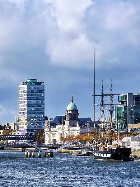 View over River Liffey towards The Jeanie Johnston Coffin Ship, The Custom House and The Spire, Dublin, Ireland