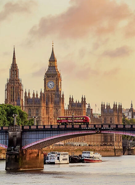 View over the River Thames towards the Palace of Westminster at sunrise, London, England, United Kingdom