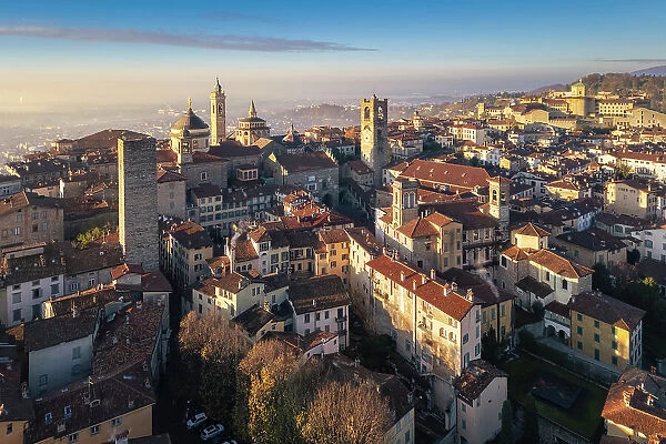 View of the rooftops, churches and towers of the Upper Town (Citt√† Alta) of Bergamo city at sunrise. Bergamo, Lombardy, Italy