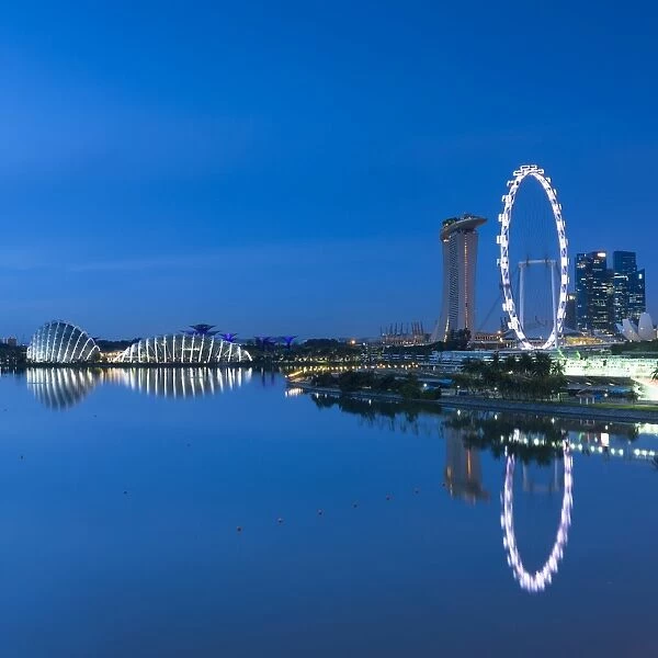 View of Singapore Flyer, Gardens by the Bay and Marina Bay Sands Hotel at dawn, Singapore