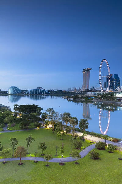 View of Singapore Flyer, Marina Bay Sands Hotel and Gardens by the Bay at dawn, Singapore