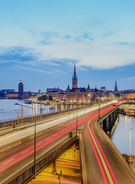View over Sodra Jarnvagsbron Bridge towards the Riddarholmen Church and City Hall at dusk, Stockholm, Stockholm County, Sweden