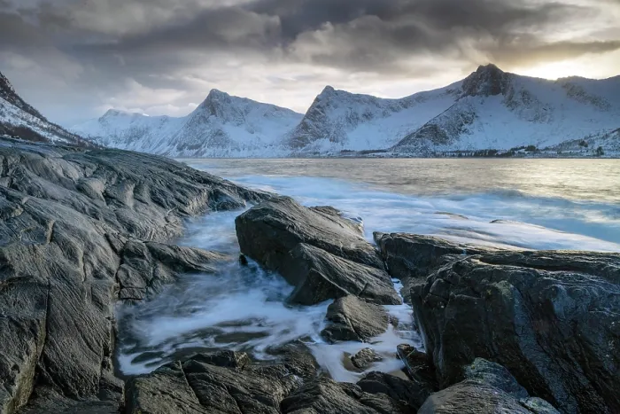 Framed Print : View towards Steinfjord and snow-covered mountains at sunset in winter, from Tungeneset, Senja Island, Norway Framed Print : View towards Steinfjord and snow-covered mountains at sunset in winter, from Tungeneset, Senja Island, Norway