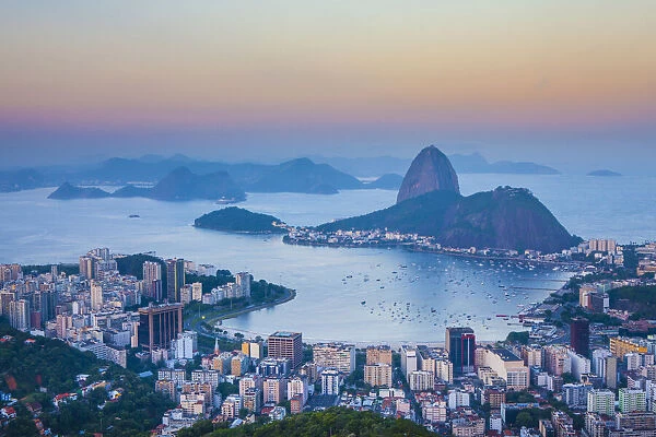 View of Sugarloaf Mountain and Botafogo Bay at dusk, Rio de Janeiro, Brazil