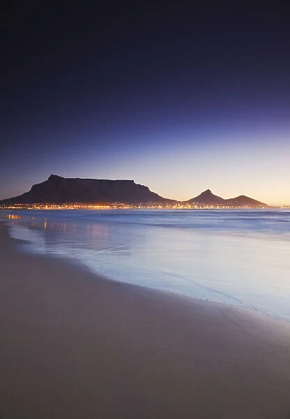 View of Table Mountain at sunset from Milnerton beach, Cape Town, Western Cape, South